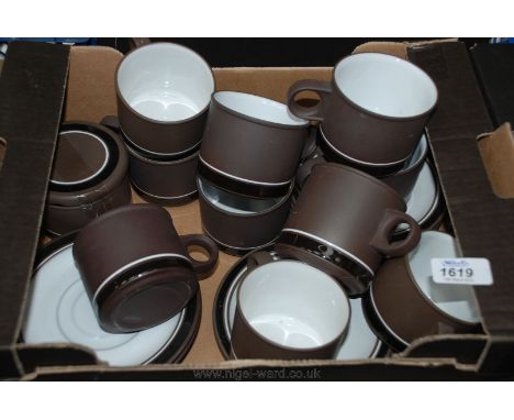 A quantity of Hornsea china in brown including eight saucers, ten cups and a lidded sugar bowl.