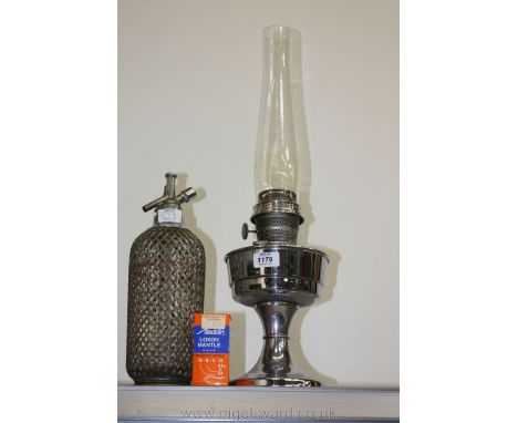 A chrome Aladdin Lamp with spare mantle together with a Soda Syphon.