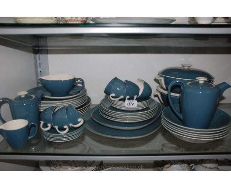 A Poole Pottery part Dinner and coffee service including dinner, breakfast and side plates, lidded serving dishes, meat plate