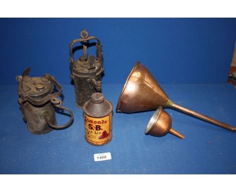 Two old hanging Oil Lamps, one marked 'The Premier Lamp', two copper Funnels and a tin can of Simonds S.B. Pale Ale.