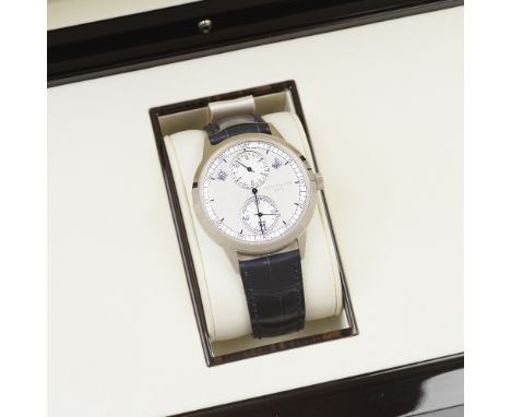 Patek Philippe. A fine 18K white gold automatic annual calendar wristwatch with regulator dialReference: 5235G-001Date: Purch
