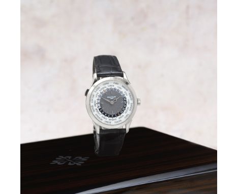 Patek Philippe. A fine 18K white gold automatic wristwatch with world time and 24 hour indicationReference: 5230G-014Date: Pu