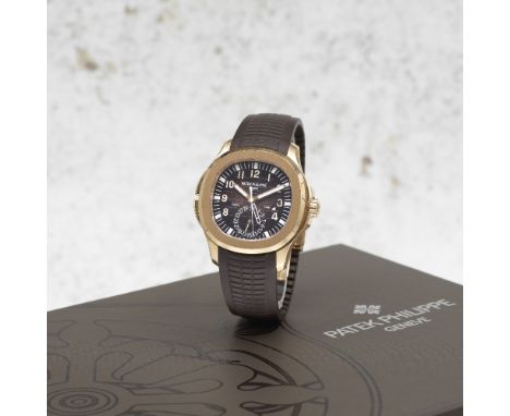 Patek Philippe. A fine 18K rose gold automatic calendar wristwatch with dual time zone and day/night indicationModel: Aquanau