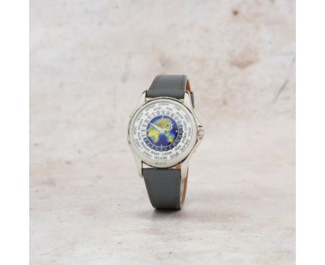 Patek Philippe. A fine 18K white gold automatic wristwatch with world time indication and polychrome closionné enamel dialMod