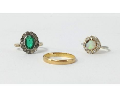 A 22ct gold wedding band, 2gms, an opal and diamond cluster ring set in yellow gold and a 9ct green stone cluster dress ring 