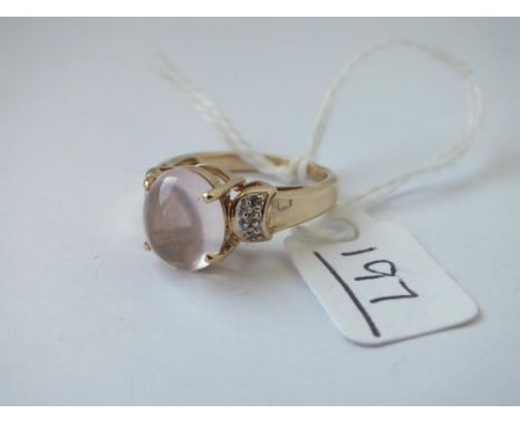 A 9ct ring set with rose quartz and white topaz stones - size O - 4.29gms