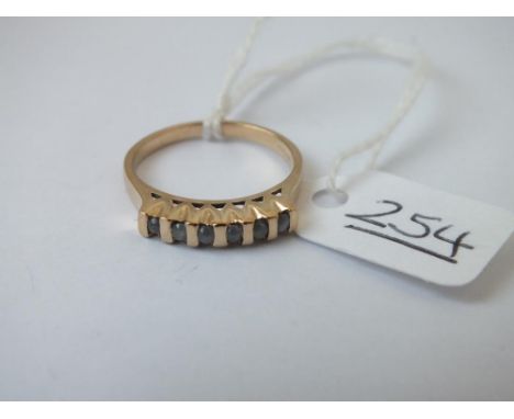 A 9ct ring set with light blue diamonds - size N - 2.24gms