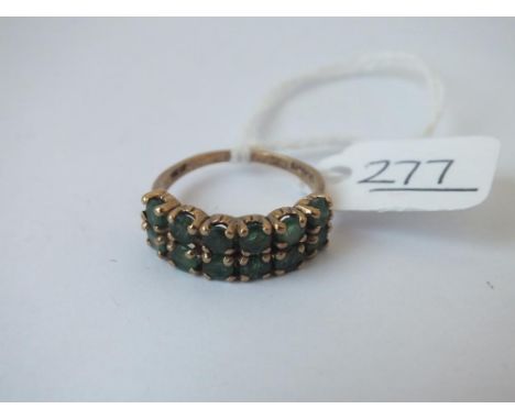 A two row emerald ring in 9ct - size N - 3.2gms