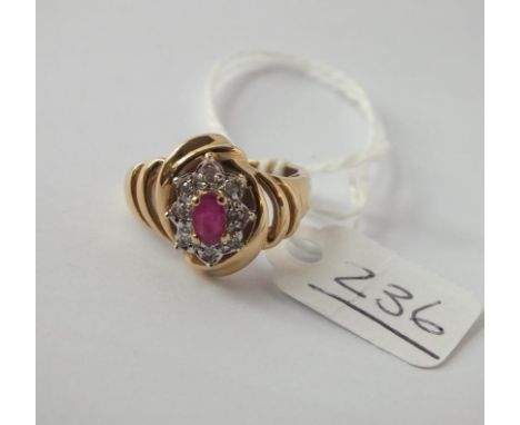 A ruby and diamond ring in 14ct gold - size M - 3.7gms