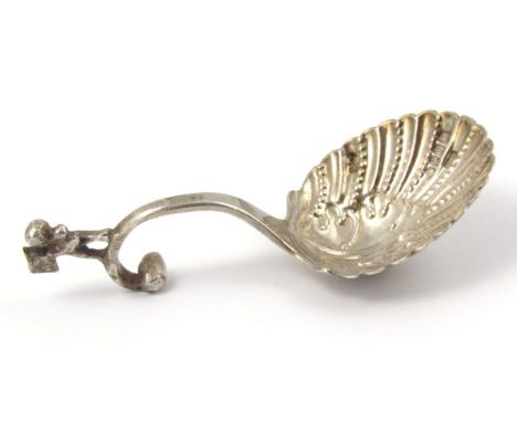 A late Victorian silver caddy spoon, probably by Samuel Boyce, with shaped figure scroll handle and shell bowl, London 1899, 