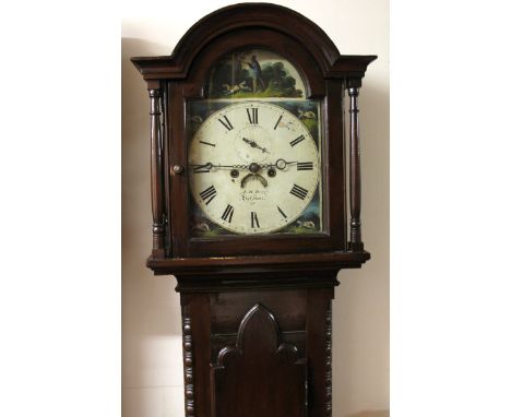 A 19thC mahogany finish stained pine eight day longcase clock, the painted arch dial signed, JM Reed Selston, with Roman nume