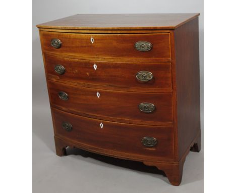 An early 19thC mahogany bow front chest, of four long drawers on stylised bracket feet, 95cm high, 101cm wide, 51cm deep.
