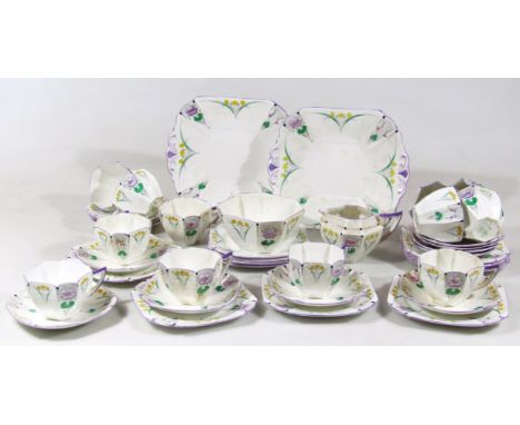 A mid 20thC Art Deco Shelley pattern 723404 part tea service, to include two serving plates, 23cm wide, shaped cups with angu