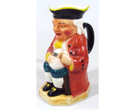 A mid 20thC Burlington ware Toby jug, typically formed, polychrome decorated holding jug and pipe on shaped base, printed mar