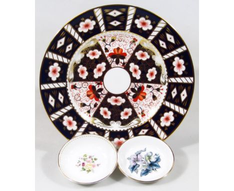 A Royal Crown Derby 2451 pattern bone china dinner plate, 27cm diameter, and two various Wedgwood and Royal Worcester saucers