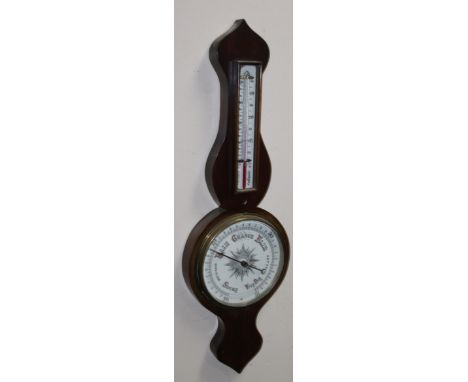 An early 20thC mahogany cased onion topped banjo barometer and thermometer, with 19cm dia. lower dial in shaped cased, 83cm h