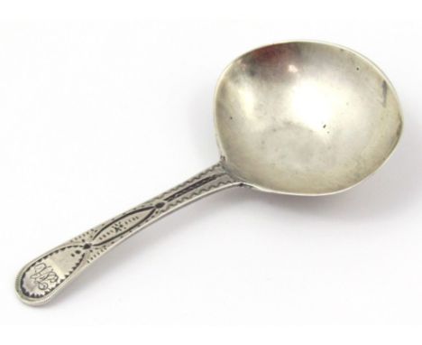 A George III silver caddy spoon, with engine turned handle and plain bowl, London probably 1803, 8cm wide 