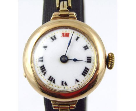 A ladies 9ct gold wristwatch, on expanding bracelet, with white enamel dial, and black hands, bezel wind, 17.2g all in.