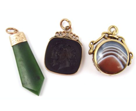 Three fobs, to include a tiger's eye and agate 9ct gold framed swivel fob, a rose gold framed intaglio fob of two male heads,