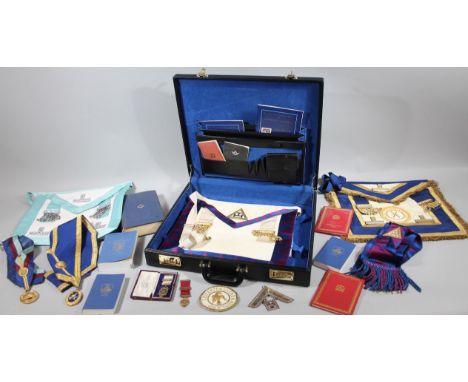 A black briefcase, containing a quantity of Masonic regalia, medal 9cm high, sash, books, Rutland badge, etc. (a quantity)