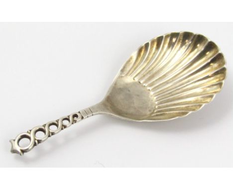 An Edwardian silver caddy spoon, by the Atkins Bros., with pierced handle and part fan shaped bowl, Sheffield 1906, 9cm wide 