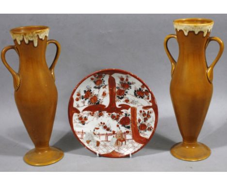 A pair of yellow glazed Burmantofts style vases, no. 413, each of classical design with shaped handles on circular feet, with