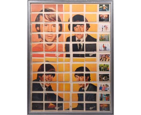 The Monkees: a framed collection of 1967 Monkees collectors cards featuring a portrait of the band. (60cm x 80cm framed and g