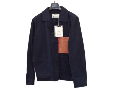 An Acne Studios jacket, navy blue with a pink patch, size 50, with tags attached.