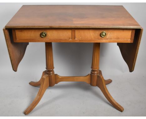 A Reproduction Crossbanded Two Drawer Sofa Table on Scrolled Support, 84cm wide when Closed 