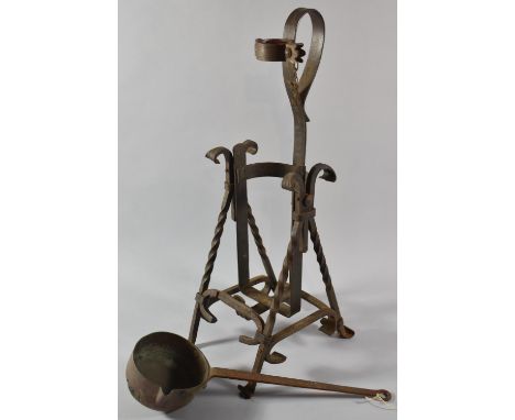 A Vintage Wrought Iron Bottle Stand/Pourer on Twisted Supports with Scrolled Feet and Loop Handle, 57cm high Together with a 