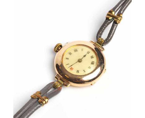 LADY'S EARLY TWENTIETH CENTURY NINE CARAT GOLD WRISTWATCH
manual wind movement, the white dial with Roman numerals and red tw