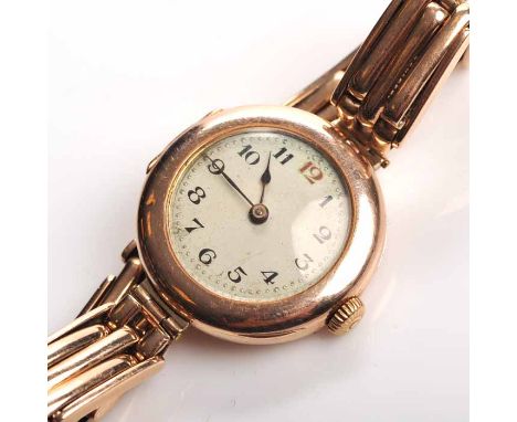 LADY'S EARLY TWENTIETH CENTURY NINE CARAT GOLD ROLEX COCKTAIL WATCH
signed fifteen jewels manual wind movement, the silvered 