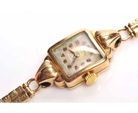 LADY'S TWENTIETH CENTURY NINE CARAT GOLD COCKTAIL WATCH
by Roamer, signed seventeen jewels manual wind movement, the white di