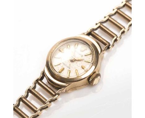 LADY'S NINE CARAT GOLD ROLEX PRECISION COCKTAIL WATCH
signed seventeen jewels manual wind movement, the silvered dial with ap