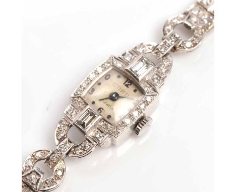 FINE LADY'S ART DECO PLATINUM AND DIAMOND COCKTAIL WATCH
signed Cordova seventeen jewels manual wind movement, the silvered d