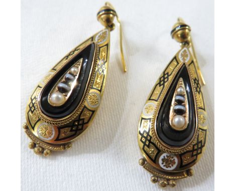 **Payment in person or by bank transfer only**Pair of Egyptianesque yellow metal and enamel earrings of tear drop shape, holl