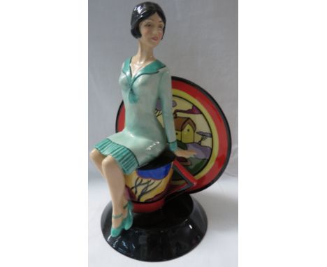 Kevin Francis limited edition figure Young Clarice Cliff depicted as woman seated on upturned cup and saucer, numbered 209/90