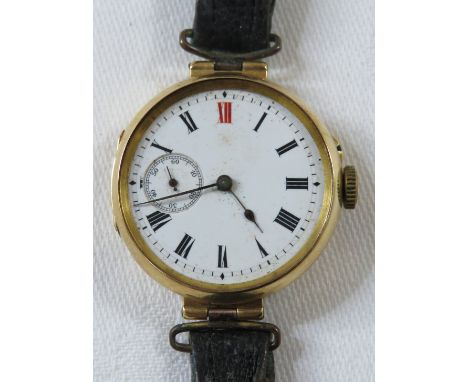 18ct gold ladies mechanical wristwatch, white enamel dial with Roman chapter XII in red, subsidiary seconds dial, the inner a