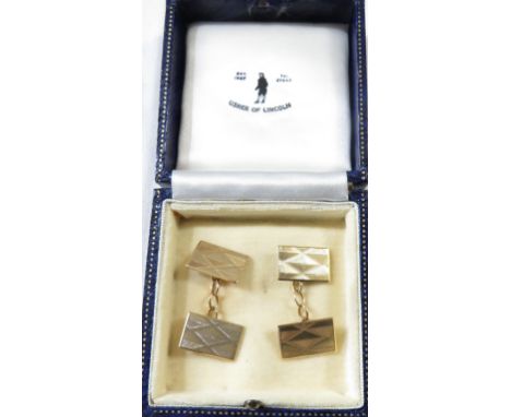 A pair of 9ct gold cufflinks, rectangular with lozenge pattern engine turning, British assay marks, combined weight 7.5g, in 
