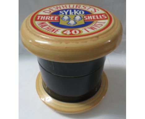Late 20th century ceramic jar modelled as a Dewhurst's Sylko reel, a lift out tray within, bearing the adhesive label Selecte