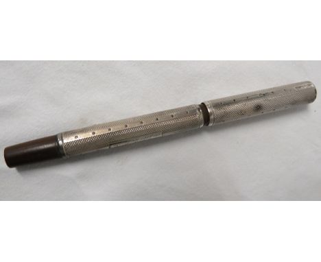A silver clad lever-fill fountain pen with horn collar and terminal, engine turned with presentation engraving, the nib marke