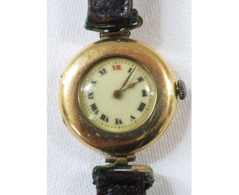 18ct gold ladies mechanical wristwatch, half-hunter enclosed dial, enamel dial with Roman chapter XII in red with gilt minute