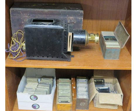 Early 20th century Steel cased magic lantern projector with brass lens and stained pine storage box. Burner removed and conve