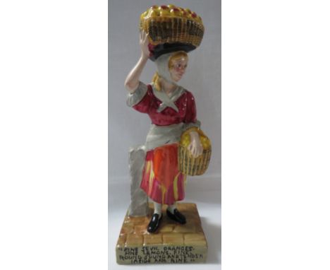 Wilkinson Ltd Clarice Cliff pottery figure of woman street vendor with fruit baskets, the base inscribed 'fine sevil oranges,