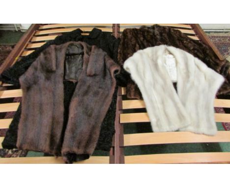 A ladies black astrakhan coat embroidered E K within, a brown mink fur coat and a brown and off white stole
