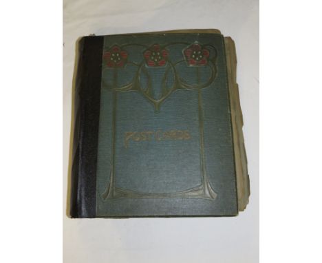 An Edwardian pictorial cover postcard album with contents of mainly first and second quarter 20th century postcards, mainly t
