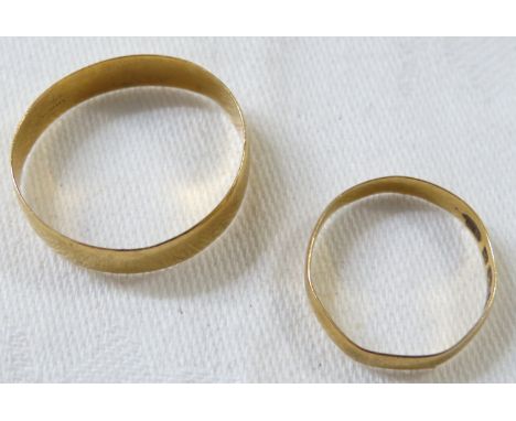 Two 22ct gold wedding rings - the first with worn hallmarks, 2.5g, size U for guidance only, the second with distinct hall ma