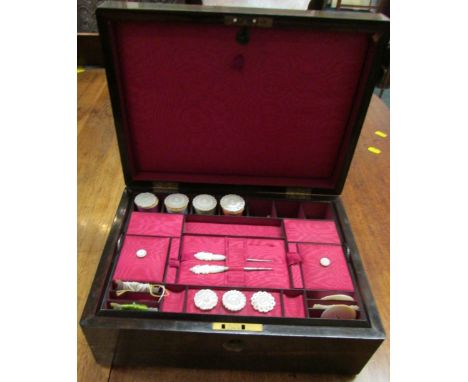 A 19th century rosewood veneer sewing box, the fitted interior lined with red satin, compartmented lift-out tray with mother 