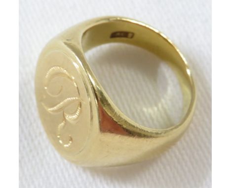 A yellow metal signet ring engraved with initial R, the shank stamped 18CT, 13g, ring size J for guidance only