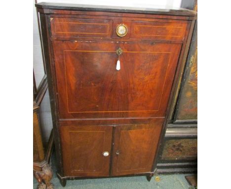 A 19th century regency style secretaire cabinet with ebony and boxwood stringing, the upper section with single drawer over f